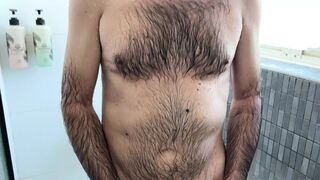 Earl is taking a bath in the bathroom