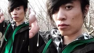 Outdoors, Jon Arteen masturbates his tumescent twink cock, ejaculates cum that sticks to his fingers and slowly drips.